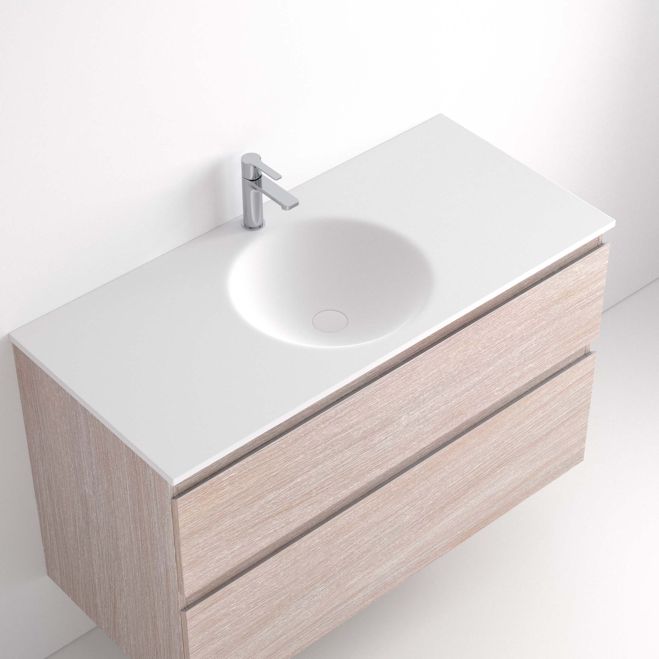 Lavabo Ávrian S1/S21 El Lavabo Ávrian S1/S21 combina líneas limpias con un diseño compacto, ideal para baños modernos. Fabricado a medida en Solid Surface, destaca por su resistencia y tacto. Disponible con opción de seno desplazado a izquierda o derecha y de doble seno desde 121 cm. Su estilo minimalista encaja en espacios contemporáneos. Perfecto para quienes buscan funcionalidad y elegancia.