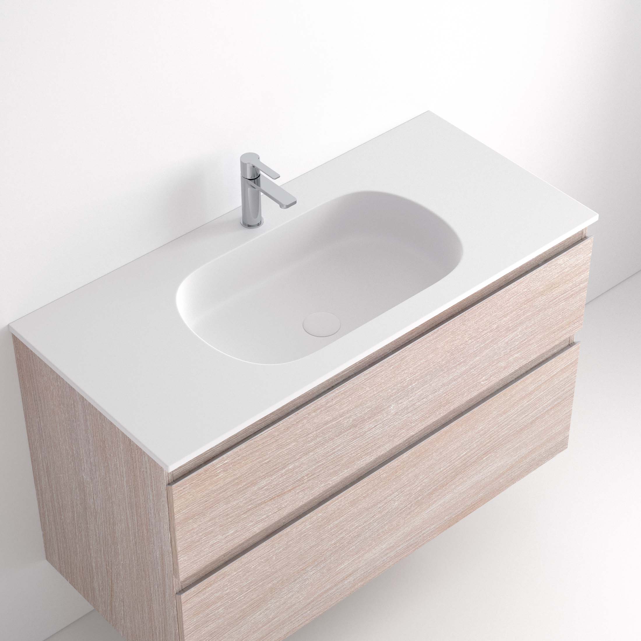 Lavabo Ávrian S1/S21 El Lavabo Ávrian S1/S21 combina líneas limpias con un diseño compacto, ideal para baños modernos. Fabricado a medida en Solid Surface, destaca por su resistencia y tacto. Disponible con opción de seno desplazado a izquierda o derecha y de doble seno desde 121 cm. Su estilo minimalista encaja en espacios contemporáneos. Perfecto para quienes buscan funcionalidad y elegancia.