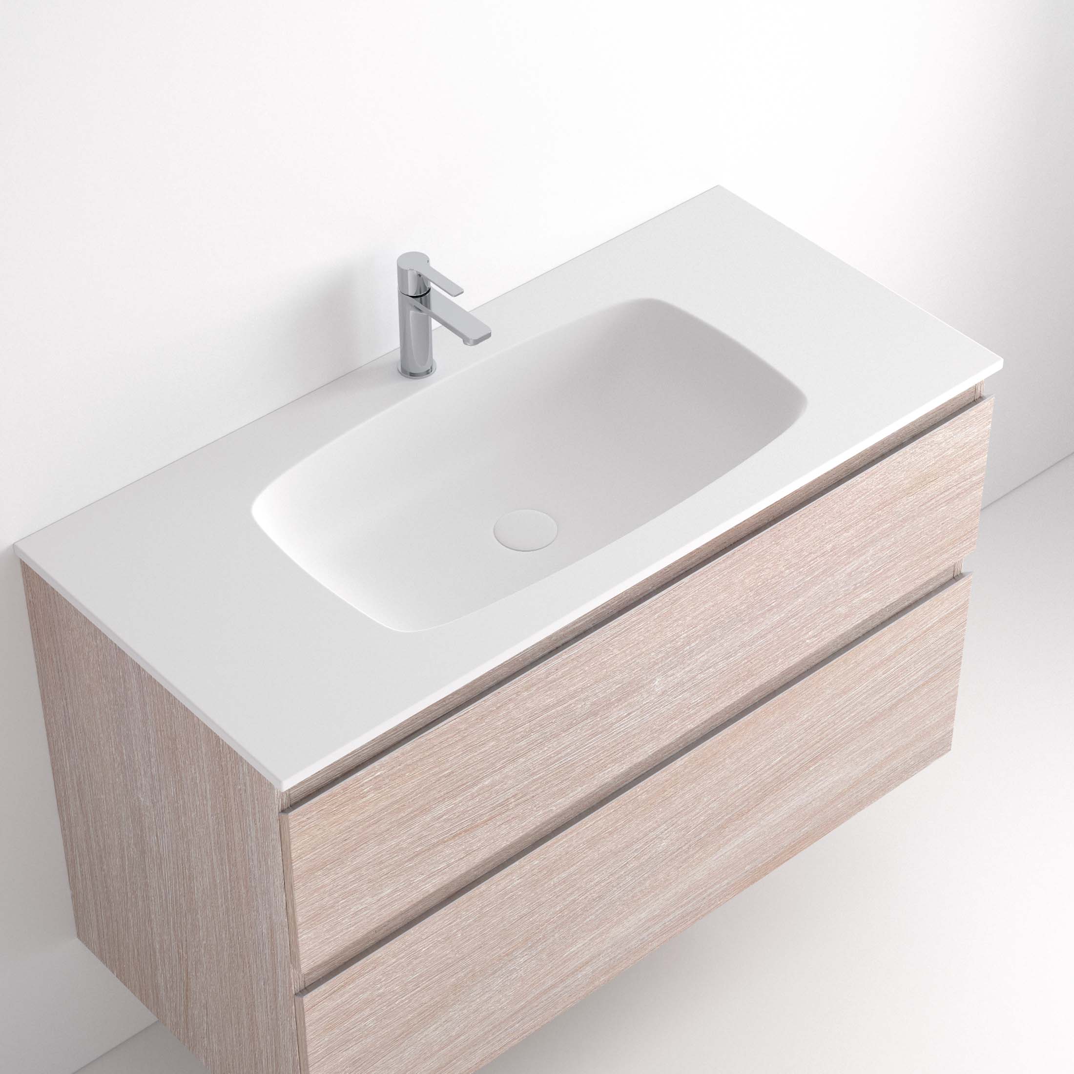 Lavabo Ávrian S1/S21 El Lavabo Ávrian S1/S21 combina líneas limpias con un diseño compacto, ideal para baños modernos. Fabricado a medida en Solid Surface, destaca por su resistencia y tacto. Disponible con opción de seno desplazado a izquierda o derecha y de doble seno desde 121 cm. Su estilo minimalista encaja en espacios contemporáneos. Perfecto para quienes buscan funcionalidad y elegancia.