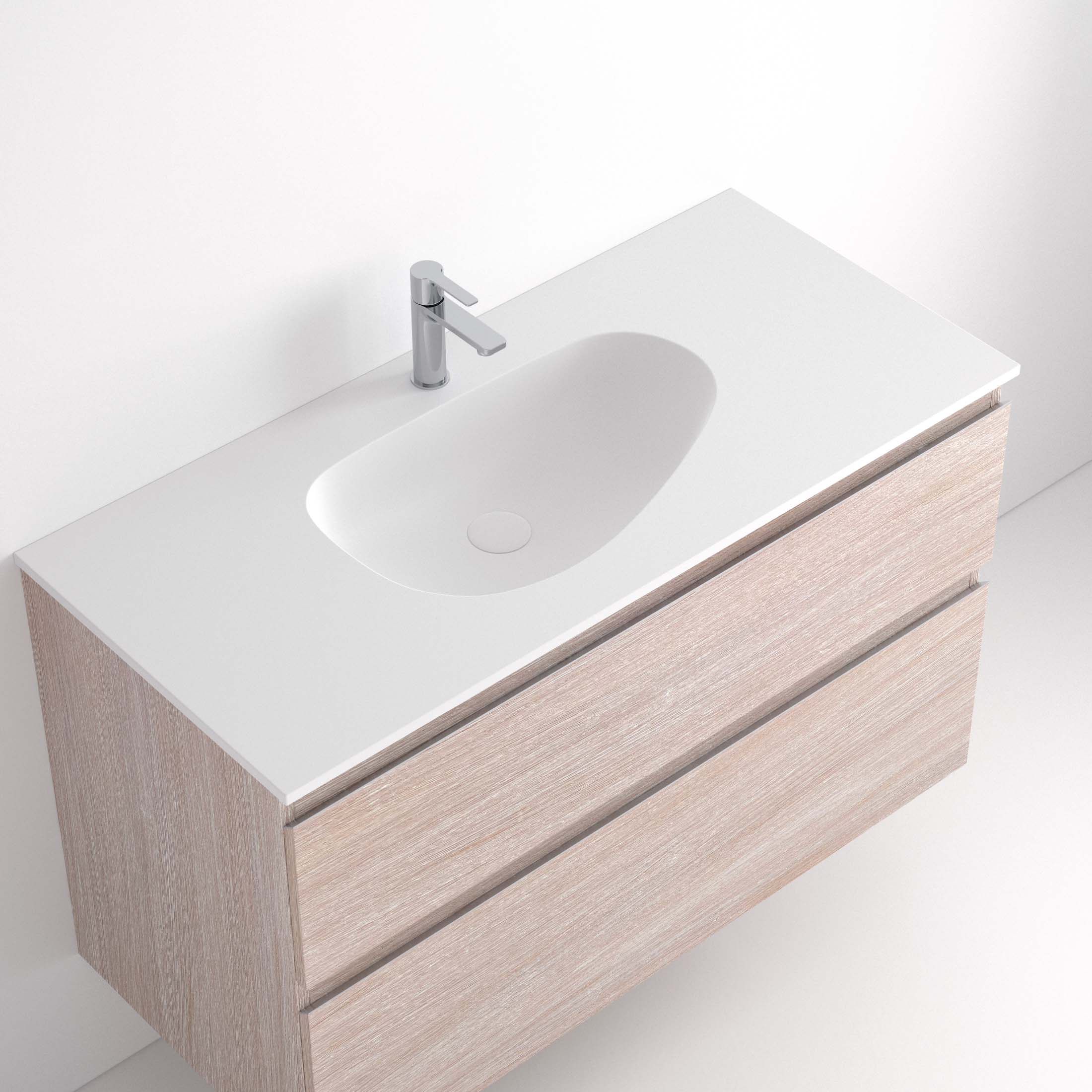 Lavabo Ávrian S1/S21 El Lavabo Ávrian S1/S21 combina líneas limpias con un diseño compacto, ideal para baños modernos. Fabricado a medida en Solid Surface, destaca por su resistencia y tacto. Disponible con opción de seno desplazado a izquierda o derecha y de doble seno desde 121 cm. Su estilo minimalista encaja en espacios contemporáneos. Perfecto para quienes buscan funcionalidad y elegancia.