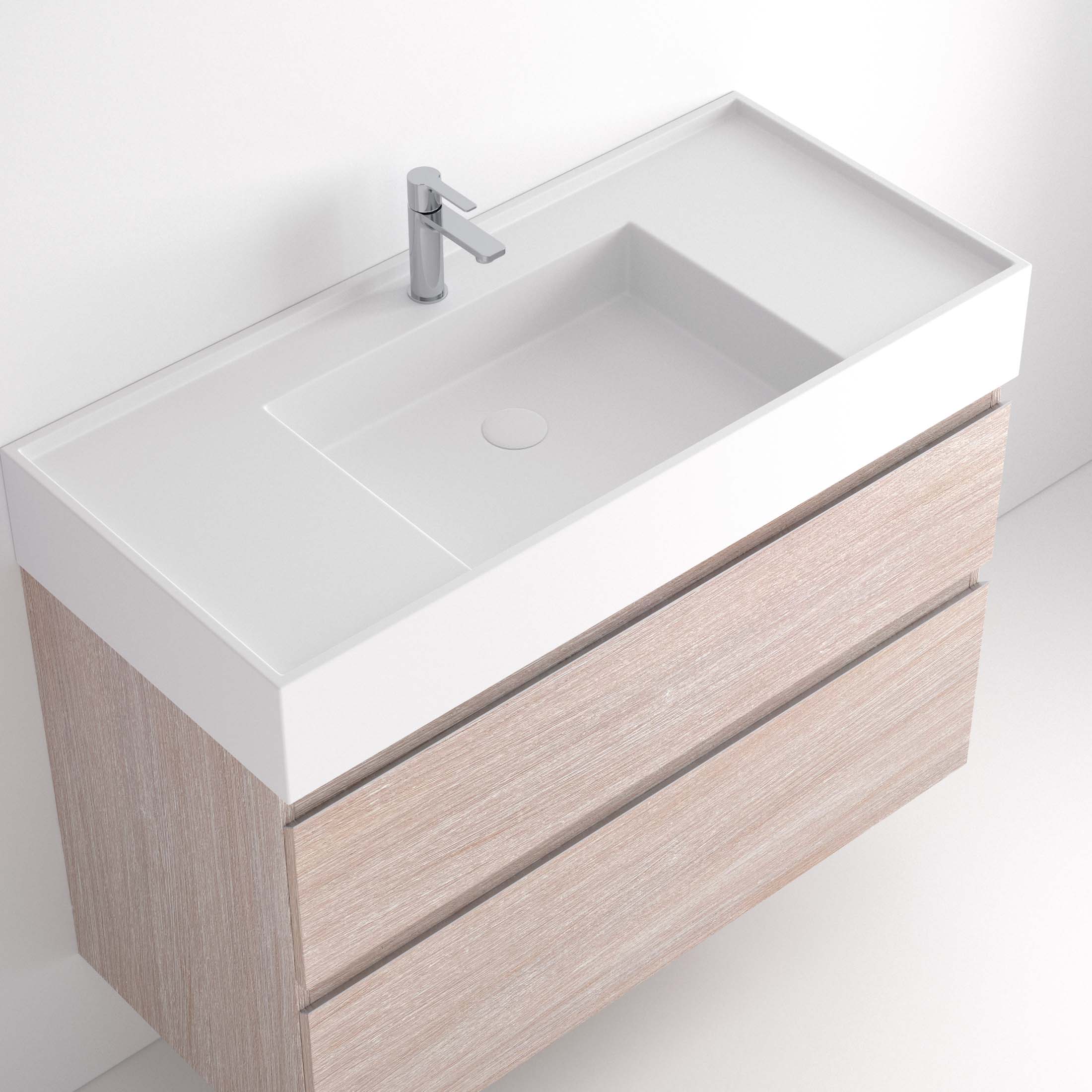 Lavabo Ávrian S1/S21 El Lavabo Ávrian S1/S21 combina líneas limpias con un diseño compacto, ideal para baños modernos. Fabricado a medida en Solid Surface, destaca por su resistencia y tacto. Disponible con opción de seno desplazado a izquierda o derecha y de doble seno desde 121 cm. Su estilo minimalista encaja en espacios contemporáneos. Perfecto para quienes buscan funcionalidad y elegancia.