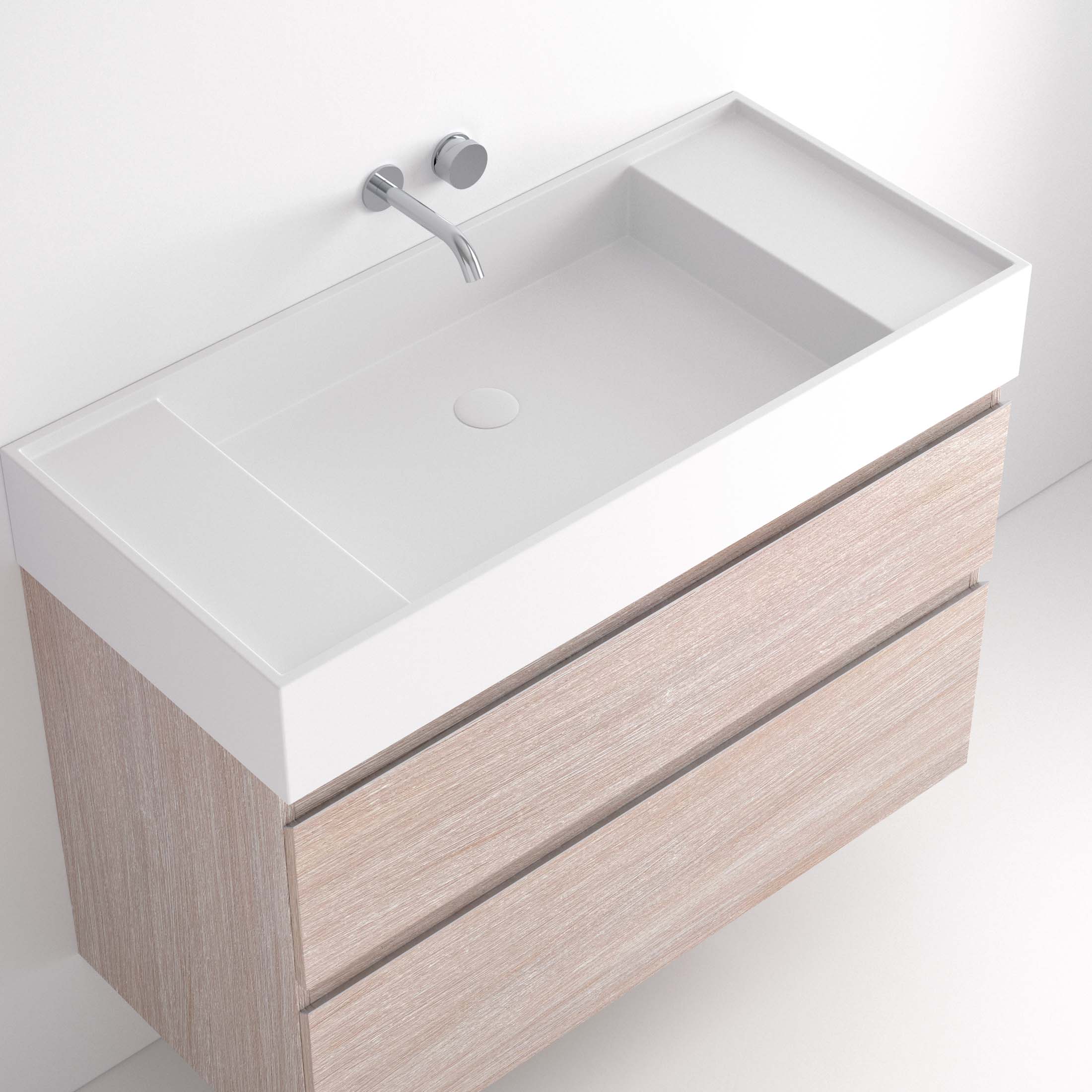 Lavabo Ávrian S1/S21 El Lavabo Ávrian S1/S21 combina líneas limpias con un diseño compacto, ideal para baños modernos. Fabricado a medida en Solid Surface, destaca por su resistencia y tacto. Disponible con opción de seno desplazado a izquierda o derecha y de doble seno desde 121 cm. Su estilo minimalista encaja en espacios contemporáneos. Perfecto para quienes buscan funcionalidad y elegancia.